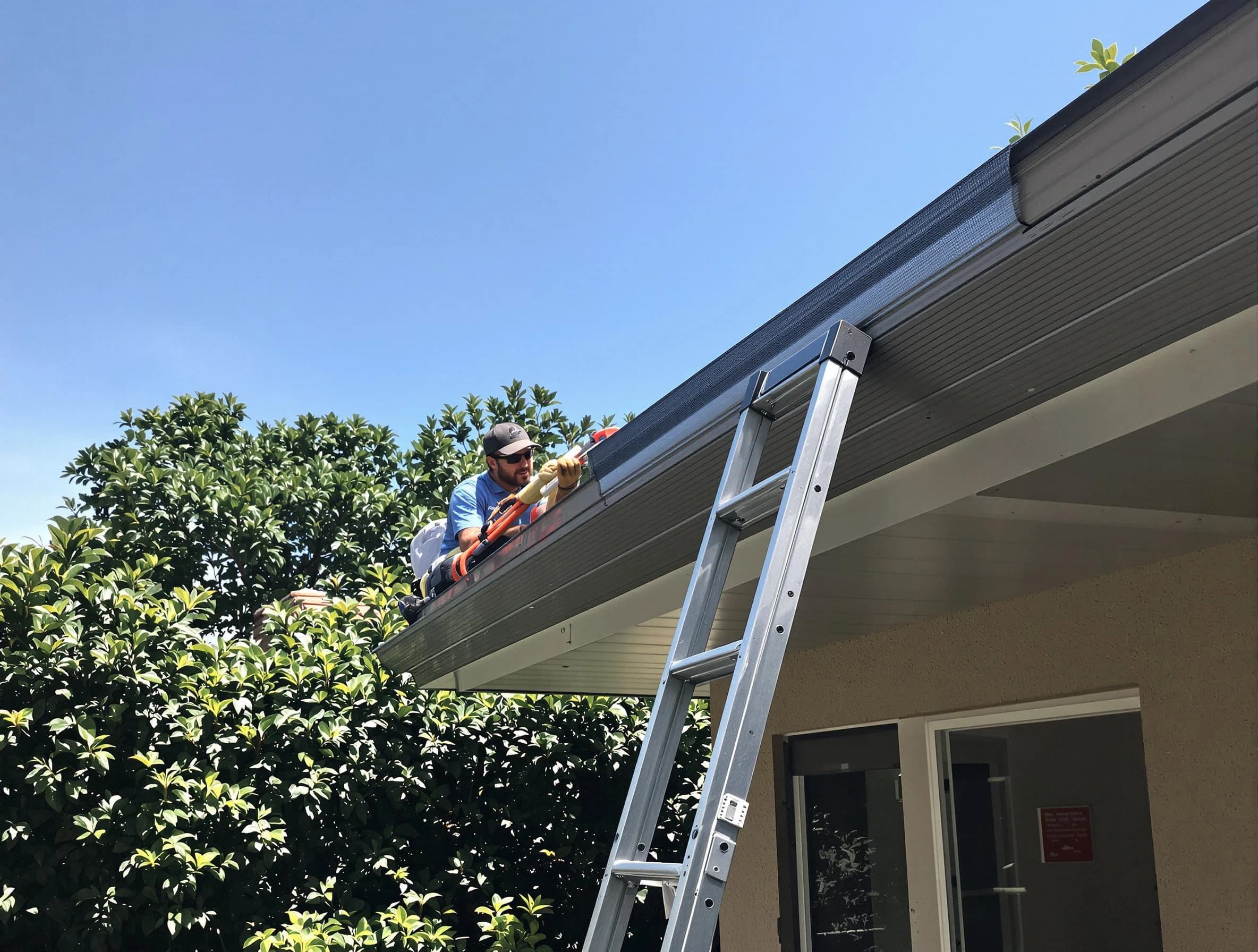 Cleveland Heights Roofing Company installing gutter guards for a homeowner in Cleveland Heights, OH